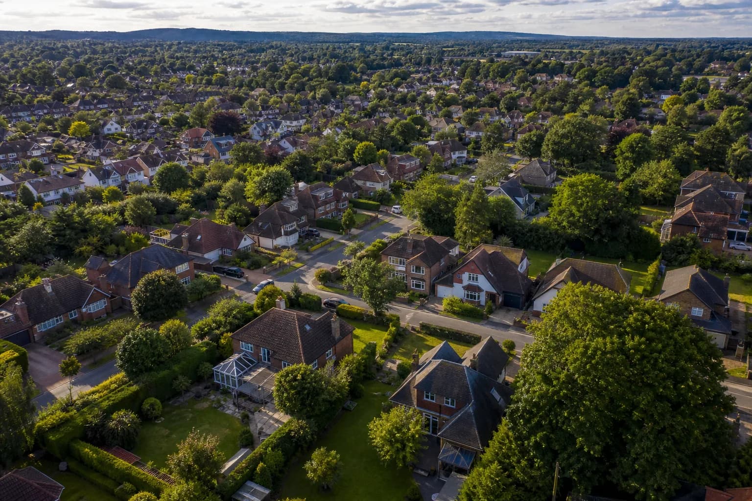 Aerial view over suburban Waterlooville homes with green gardens